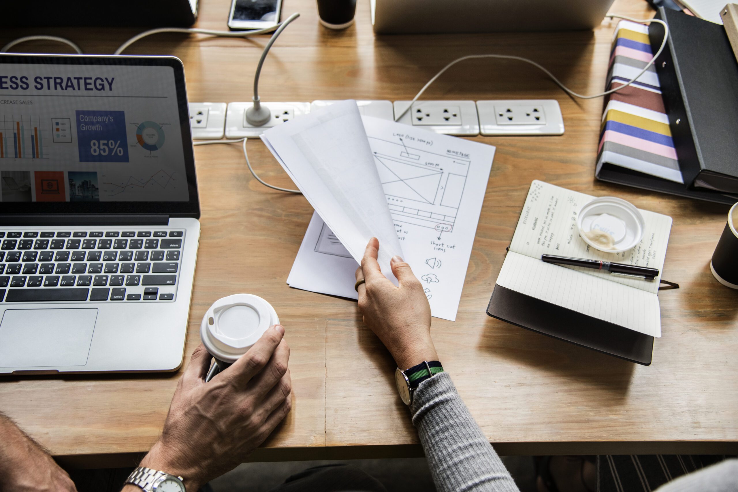 Team reviewing layouts and planning design concepts at a workspace, representing Chema Foam’s design services 